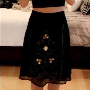 DKNY, Black ornamental skirt.
